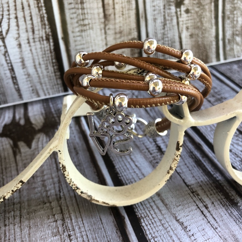 Faux leather bracelet with a stamped charm.